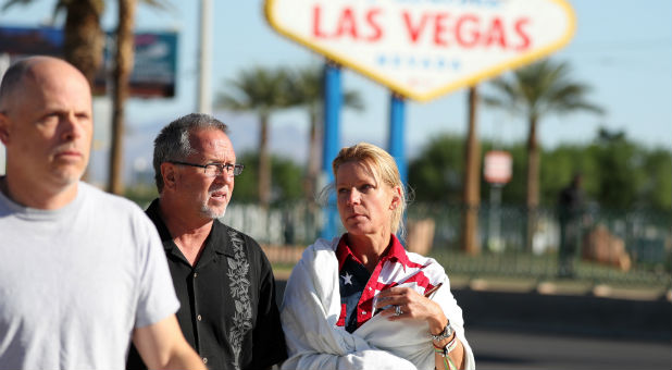 A woman wearing a Route 91 wristband walks near the Mandalay Bay Resort and Casino following a mass shooting at the Route 91 Festival in Las Vegas.