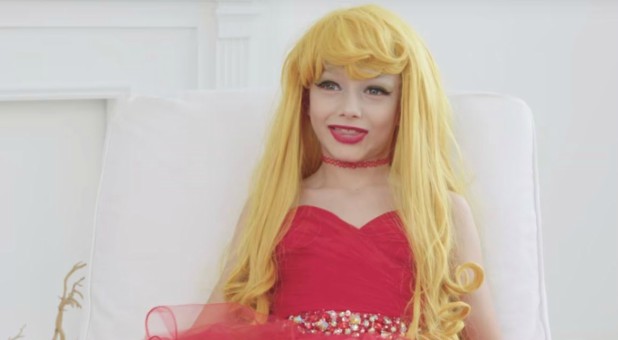 A little boy dressed in drag.