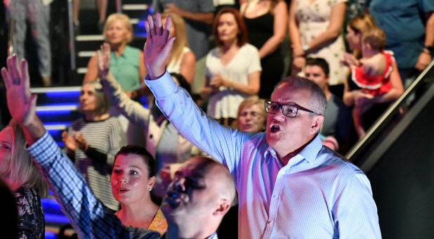 Prime Minister Scott Morrison and wife, Jenny, sing during an Easter Sunday service at his Horizon Church at Sutherland in Sydney, Australia.