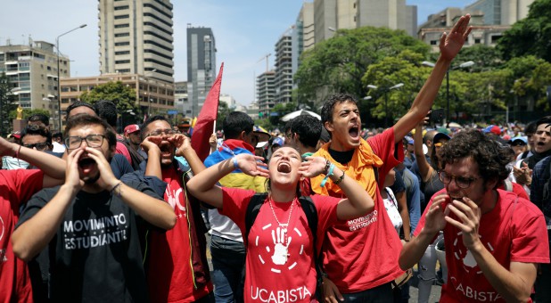 Supporters of Venezuelan opposition leader Juan Guaido, whom many nations have recognized as the country's rightful interim ruler, chant slogans as they take part in a rally against the government of Venezuela's President Nicolas Maduro.