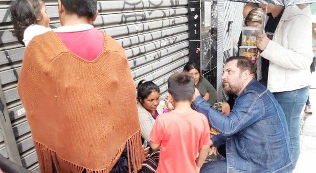 A man ministers in Brazil as part of the 2019 Global Outreach Day.