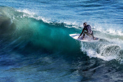 Surfing Over the Dark Waves of Life
