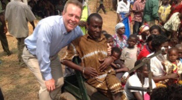 Blake with Princess Betty's nephew in a PET at Chief Kanyama's Rain Festival