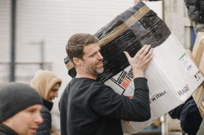 Michael Evans helps unload food and supplies to assist the people in war-torn Ukraine.